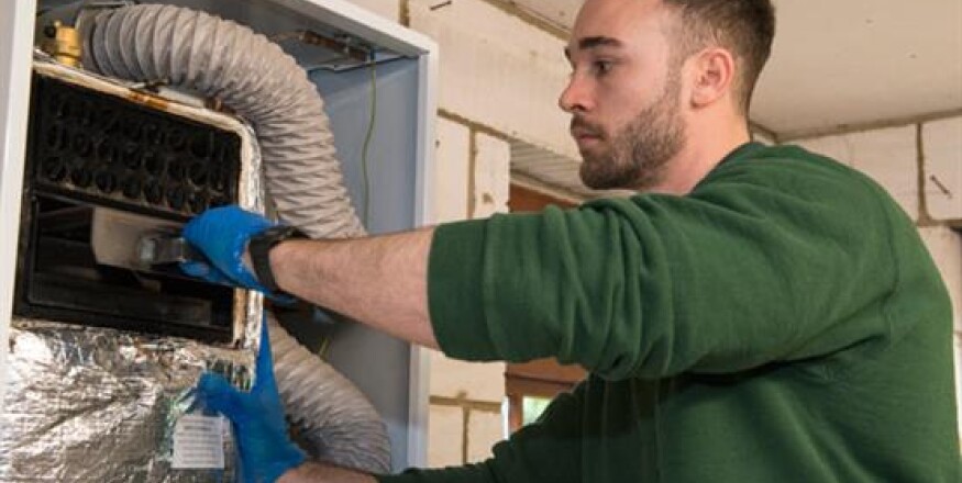 technician servicing boiler 1